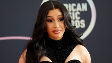 Photo of Cardi B throws microphone at an individual who recklessly hurled a drink at her