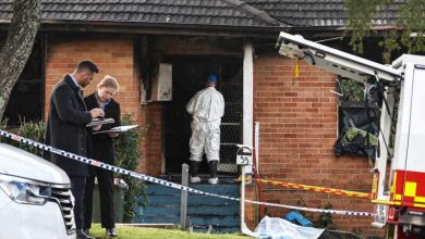 Photo of Australian father charged with murdering three of his children in house fire